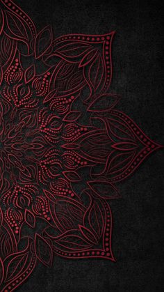 a black and red background with an intricate design