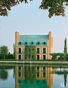 a large building sitting next to a body of water