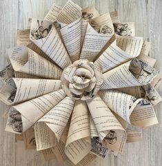 an origami flower made out of old book pages