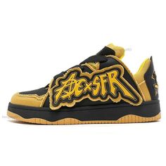 a yellow and black sneaker with the word fear on it's upper part