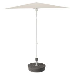 an umbrella is shown on top of a stand with the base extended to allow shade