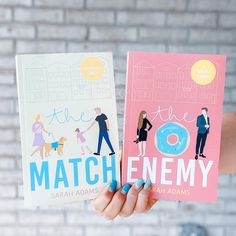 two children's books in their hands with the title match me and the enemy