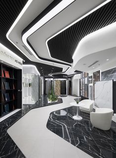 the interior of a modern office building with marble flooring and black and white decor