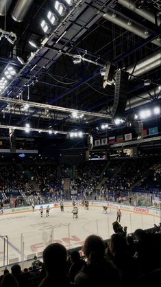 an ice hockey game is being played in the arena