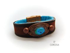 Beautiful one of a kind handcrafted southwestern leather bracelet made of earthy mid-western style brown dyed veg tan leather. The focal point is a natural stabilized Tibet turquoise with a bezel setting in solid copper. Southwestern Style Brown Bracelets For Gift, Southwestern Style Brown Bracelets As Gift, Southwestern Style Brown Bracelets Gift, Southwestern Style Brown Bracelet Gift, Western Style Turquoise Leather Bracelets, Southwestern Turquoise Leather Bracelet As Gift, Western Style Brown Cuff Bracelet As Gift, Turquoise Leather Concho Bracelets, Southwestern Style Brown Bracelet Jewelry