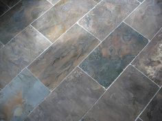 a tile floor with different colors and patterns