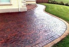 a brick walkway in front of a house