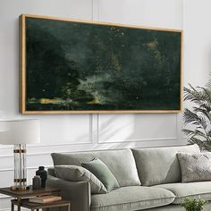 a living room filled with furniture and a large painting on the wall above it's couch