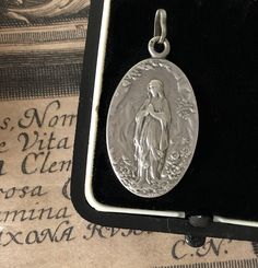 French Religious Medal, Blessed Virgin, Sterling Silver Pendant Antique Silver Medallion With Miraculous Medal, Antique Charms Jewelry For Commemoration, Miraculous Medal Pendant Gift, Memorial Spiritual Vintage Charm Necklace, Antique Oval Necklaces With Charms, Commemorative Pendant Jewelry With Vintage Charm, Antique Silver Jewelry With Miraculous Medal, Commemoration Pendant Jewelry With Vintage Charm, Engraved Spiritual Medallion Jewelry