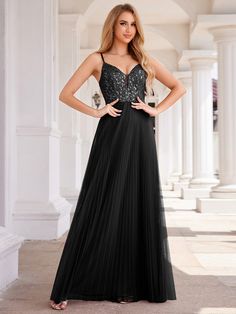 This sophisticated evening dress features a V-neck sleeveless top and a shimmering sequined bodice. The high-waisted tulle skirt enhances its ethereal look, while the open back adds a touch of design. Fit: Please refer to size chart. Length: Floor Length. Sleeve Style: Sleeveless. Closure: It is concealed a zipper up the back. Undergarments: It is not padded, with lining. Fabric:The garment comprises tulle. Stretch: Fabric is no stretch. Backless Evening Dress, Tulle Evening Dress, Womens Prom Dresses, Prom Dresses Sleeveless, Formal Evening Dress, Backless Design, Evening Dresses Elegant, Black Prom Dresses, Formal Evening Dresses