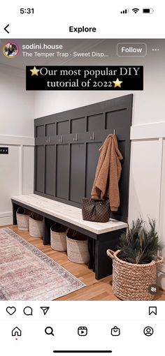 an image of a room with a bench and coat rack