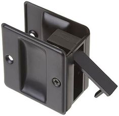 the black door handle is attached to an outside wall bracket with two square knobs