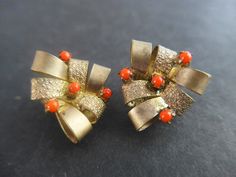 This listing is for a pair of vintage clip earrings, made in Europe 1050th. Made from brass and red glass. Excellent condition, clips in good working order. European flea market find. 2.5cm/1" in diameter All items will be ready for shipping within 3 business days. I will send your tracking number as soon as your item has been posted. Please always make sure to enter your correct shipping address and provide contact phone number for the delivery service. Vintage Red Clip-on Earrings For Evening, Vintage Red Clip-on Earrings For Anniversary, Red Vintage Clip-on Earrings For Anniversary, Vintage Orange Clip-on Earrings, Vintage Orange Earrings For Party, Orange Vintage Earrings For Party, Vintage Red Clip-on Earrings, Vintage Red Brass Earrings, Red Vintage Clip-on Earrings