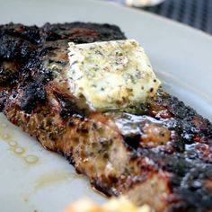 grilled meat and cheese on a white plate