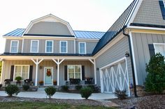 a large house with two garages on the front and side of it's sides