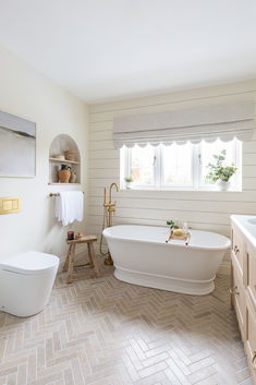 Dijon tumbled metro tiles laid in a herringbone pattern, in a newly renovated bathroom. Brick Tile Floor Bathroom, Brick Tile Floor, Limestone Floor Tiles