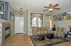 a living room with two couches and a fireplace