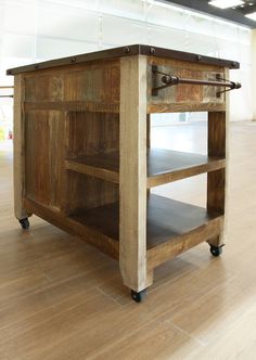 a kitchen island made out of wood with wheels on the bottom and one drawer open