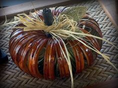 a decorative pumpkin sitting on top of a woven mat