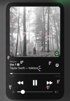 the music player is playing with pink hearts in the woods on it's screen