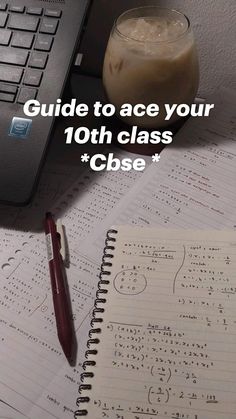 a notebook and pen sitting on top of a desk next to a computer keyboard with the words guide to ace your 10th class case