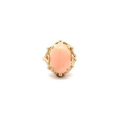 A lady's coral ring.  Prong set in the center of the ring is an oval coral cabochon.  The ring has a scroll style undercarriage and a cathedral profile. This ring is a size 4.75.  This listing includes a sizing up or down 2 sizes.  Once a ring is re-sized, we guarantee the work but we are unable to offer a full refund on the ring. Please contact us for additional sizing options and expected ship date. Metal Content Guaranteed 14k yellow gold Weight: 4.9 grams Measurements of Ring 5/8 inches wide Classic Pink Oval Cabochon Ring, Elegant Carnelian Oval Cabochon Ring, Elegant Coral Oval Jewelry, Vintage Oval Coral Jewelry, Coral Oval Cabochon Jewelry, Coral Ring, Personalized Gift Wrap, Red Jewelry, Pink Coral