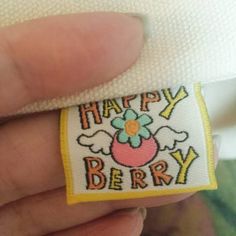 someone is holding a happy berry patch in their left hand and it says, happy berry