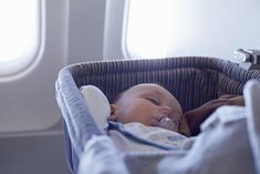 a baby laying in a crib with an oxygen tube attached to it's mouth