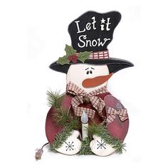 a snowman with a hat and scarf on it's head is sitting in front of a sign that says let it snow