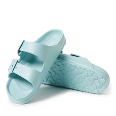 This versatile seasonless women's shoe make a perfect gift for Mother's Day, birthdays, Christmas, Easter or vacation travel. Manufactured with BLOOM harvested algae, dried out and infused into the EVA to help clean polluted waters and air. Sixty (60) liters of clean water are returned to habitat and 38 M3 of air cleaned, per single pair of women's sandals produced. Light Blue Slide Sandals For Vacation, Light Blue Slip-on Sandals For Vacation, Light Blue Slip-on Beach Sandals, Light Blue Open Toe Slides For Vacation, Casual Blue Slip-on Footbed Sandals, Light Blue Slides For Spring Beach Outings, Light Blue Slides For Beach In Spring, Light Blue Flat Slides For The Beach, Light Blue Slides For Beach