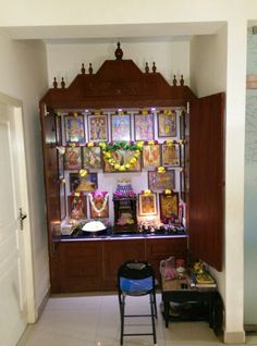 a room filled with wooden cabinets and pictures on the wall