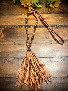 "Long 44\" ribbon/rag beaded necklace  with  7\" fringe perfect addition to your collection! ❤️🦋❤️🦋" Handmade Adjustable Brown Tassel Necklace, Brown Tassel Necklaces As Gifts, Adjustable Lariat Beaded Necklaces With Tassels, Brown Tassel Necklace For Festival, Adjustable Fringe Tassel Necklace For Festival, Adjustable Tassel Necklace With Fringe For Festivals, Adjustable Bohemian Tassel Necklace With Beaded Fringe, Bohemian Tassel Necklace With Beaded Fringe, Artisan Beaded Fringe Adjustable Necklace