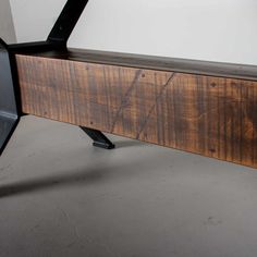 a bench made out of wood and metal