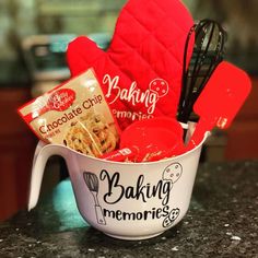 a baking gift basket with red mitts, cookies and other kitchen utensils