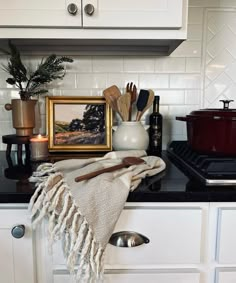 a kitchen counter with utensils on it