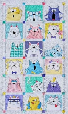 a quilt with many cats on it