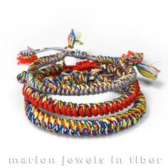 multicolored bracelets on white background