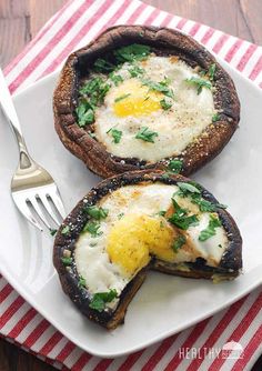 a white plate topped with two pieces of bread covered in an egg