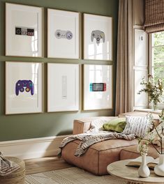 a living room with green walls and pictures on the wall above it's couch