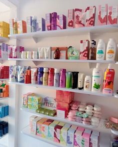 the shelves are filled with many different types of cosmetics and lotion bottles on them