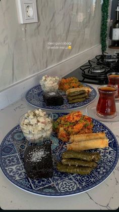 three plates with different types of food on them sitting on a kitchen counter next to an oven