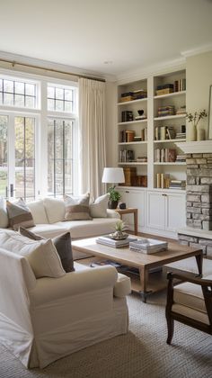 a living room filled with furniture and a fire place