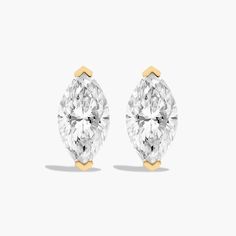 14K Yellow Gold Marquise Cut Diamond Stud Earrings (2.00 CTW - H-I / SI1-SI2). This pair of classic marquise cut diamond earrings feature a tapered basket, showcasing the unique characteristics and striking outline of a marquise cut diamond. Splinters of light shimmer and shine with every move. Gold Pearl Ring, Rings Mens Wedding Bands, Carved Ring, Classic Wedding Rings, Platinum Wedding Rings, Cushion Cut Ring, Pink Sapphire Ring, Shimmer And Shine, Round Cut Engagement Rings