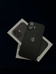 an iphone 11 pro sitting on top of a package next to it's packaging