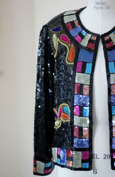 "What a beauty!! This Stunning Judith Ann Creations heavily beaded cropped jacket is just beautiful..great way to dress up your evening! There is one hook and eye at the top..which makes the top very versatile. Very good condition.. i do not see any missing beads and there is terrific trim as well as beads throughout. Measuring: length:21\" Width: 40\" Sleeve length: 22\" A real M/L Pet Free/smoke free Enjoy!" Glamorous Beaded Outerwear For Evenings, Fitted Multicolor Evening Outerwear, Spring Beaded Outerwear For Parties, Spring Party Beaded Outerwear, Beaded Fitted Outerwear For Night Out, Bohemian Party Outerwear With Sequins, Bohemian Style Embellished Outerwear For Party, Bohemian Embellished Party Outerwear, Glamorous Beaded Evening Outerwear