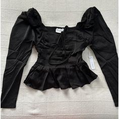 Top To Bottom: 16.5” Armpit To Armpit: 13”. I Ship Out Same Day Or Next Day. Please Message Me If You Have Any Questions. Elevate Your Wardrobe With This Stunning Six/Fifty Black Blouse. The Long Puff Sleeves And Peplum Side Detailing Add A Touch Of Elegance To The Cropped Square Neck Top. The Zipper Closure Ensures A Secure Fit While The Solid Pattern And Polyester Material Make It Suitable For Any Occasion, Be It A Wedding, Party Or Casual Event. This Versatile Blouse Is Perfect For Women's Cl Casual Black Fitted Blouse, Long Sleeve Black Blouse For Brunch, Black Long Sleeve Blouse For Brunch, Black Puff Sleeve Blouse With Ruffles, Black Blouse For Brunch In Fall, Spring Black Blouse For Night Out, Black Blouse For Spring Night Out, Trendy Black Blouse For Brunch, Black Blouse For Night Out In Spring