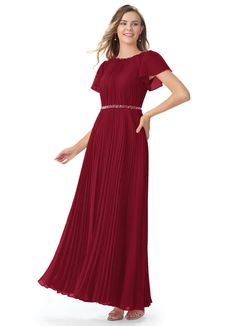 a woman in a long red dress with short sleeves and pleaing on the waist