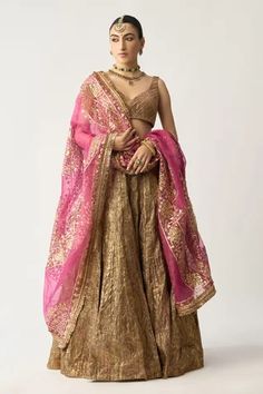 Purple gold attached can-can lehenga in lampi paired with leaf neck and sleeveless padded blouse. Comes with fuchsia silk organza gota patti dupatta edged with kiran.
Component: 3
Neckline: Leaf
Sleeve Type: Sleeveless
Fabric: Lampi, Silk Organza, Lining: Cotton and Shantoon
Color: Gold,Purple
Other Details: 
Embroidered dupatta
Occasion: Destination Wedding - Aza Fashions Bridal Lehenga Maroon, Embellished Bodysuit, Bridal Lehenga Online, Bridal Lehenga Designs, Organza Lehenga, Bridal Lehenga Collection, Designer Bridal Lehenga, Lehenga Online, Lehenga Choli Online