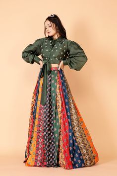 Item details: HANDMADE Designer Sukriti here  our exclusive Ritu Kumar inspired multicolor lehenga with stitched blouse is perfect to steal everyone's heart and attention 💃💃FABRIC DETAILS #LEHENGA :- SATIN PRINTED STITCHED IN BOX PLEATS  INNER :- Shantoon  LENGTH:- UPTO 40"(customisable) SIDE ZIP AND HOOKS # BLOUSE:- MODAL SATIN STITCHED IN SHIRT STYLE WITH BOW and hand embroidery  FRONT OPENING WORK:- BEADWORK SLEEVES:- BALLOON SLEEVES WITH CUFF  🪡Refer to size chart for your perfect size KI Lehnga Top Designs Latest, Modern Lehenga Designs Crop Tops, Satin Shirt With Lehenga, Box Pleat Lehenga, Shirt With Lehenga, Designer Crop Top Lehenga, Modern Lehenga Designs, Blouse Modal, Multicolor Lehenga