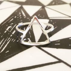 I handcraft each triangle ring out of tarnish resistant Argentium sterling silver square wire. I give it high polish for a clean modern look. It's strong and sturdy for everyday wear and care. Each ring is made to order just for you! P R O D U C T I O N ~ T I M E : Depending on my current amount of orders, it usually takes me 1-2 weeks to craft your item. Message me if you need a rush order! Send questions my way anytime! Peace & Gratitude, ♥Ali Rae Additional ~ D E T A I L S What is Argenti Modern Silver Hypoallergenic Stackable Rings, Modern Hypoallergenic Silver Stackable Rings, Geometric Silver Ring As Gift, Silver Geometric Rings As Gifts, Silver Geometric Ring As Gift, Silver Geometric Ring Gift, Silver Geometric Ring For Gift, Modern Hypoallergenic Sterling Silver Midi Rings, Modern Nickel-free Sterling Silver Midi Rings